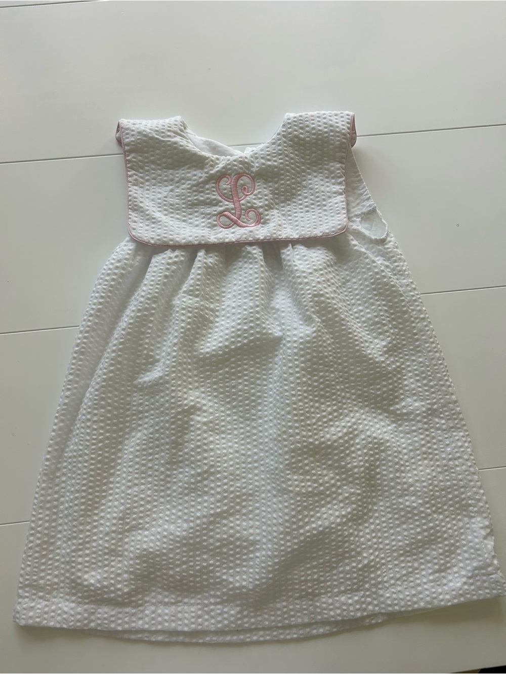 White Seersucker Girls' Dress with Pink Trim and Monogram Accent